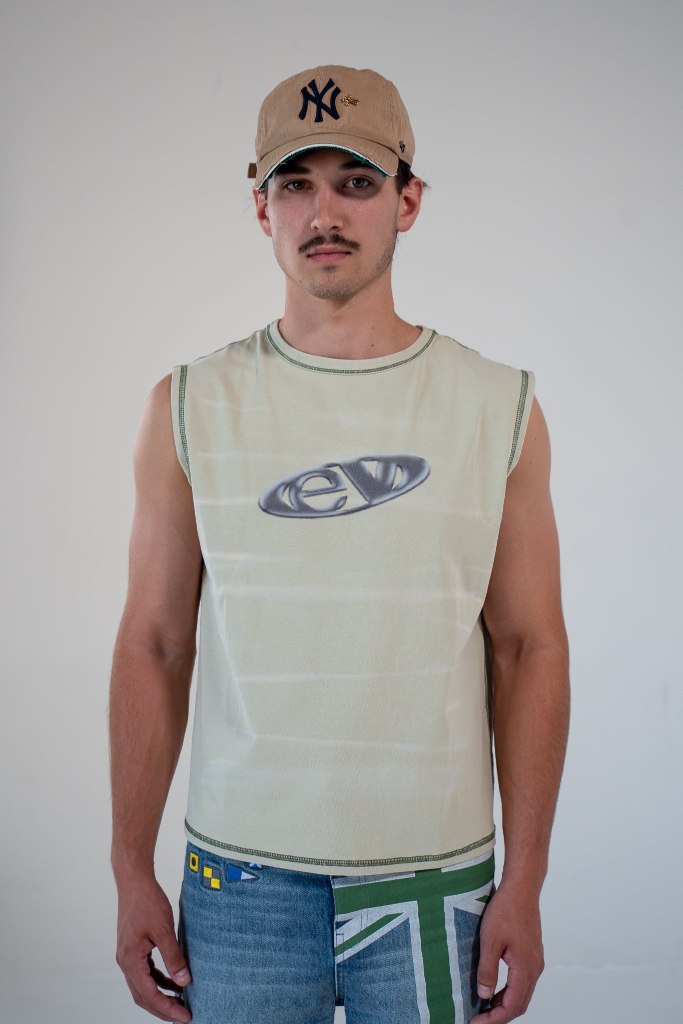 leaf finished cutoff tank top with alloy emblem