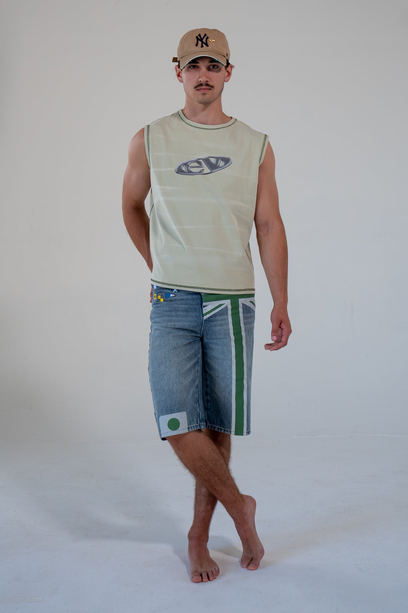 leaf finished cutoff tank top with alloy emblem