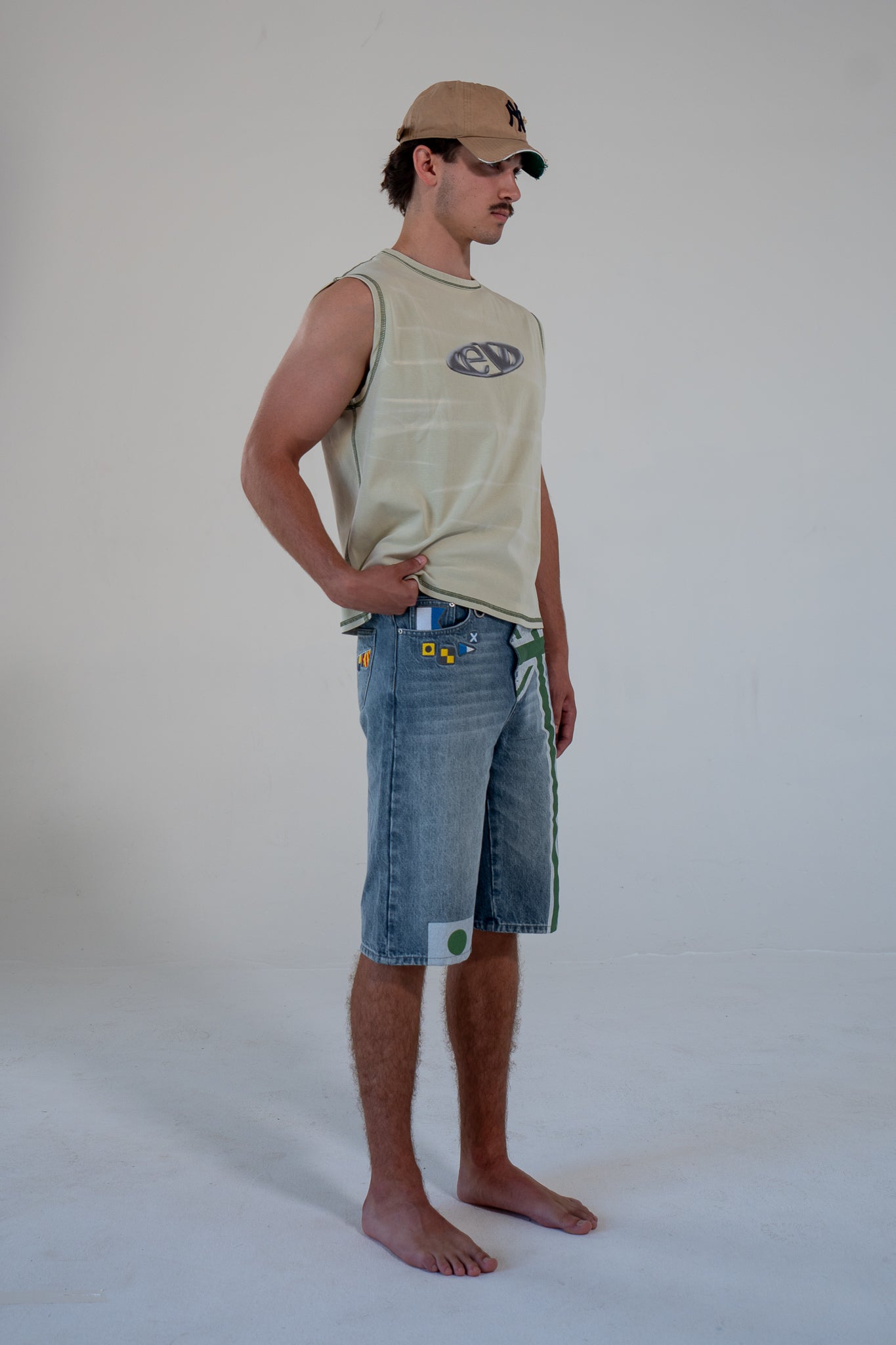 leaf finished cutoff tank top with alloy emblem