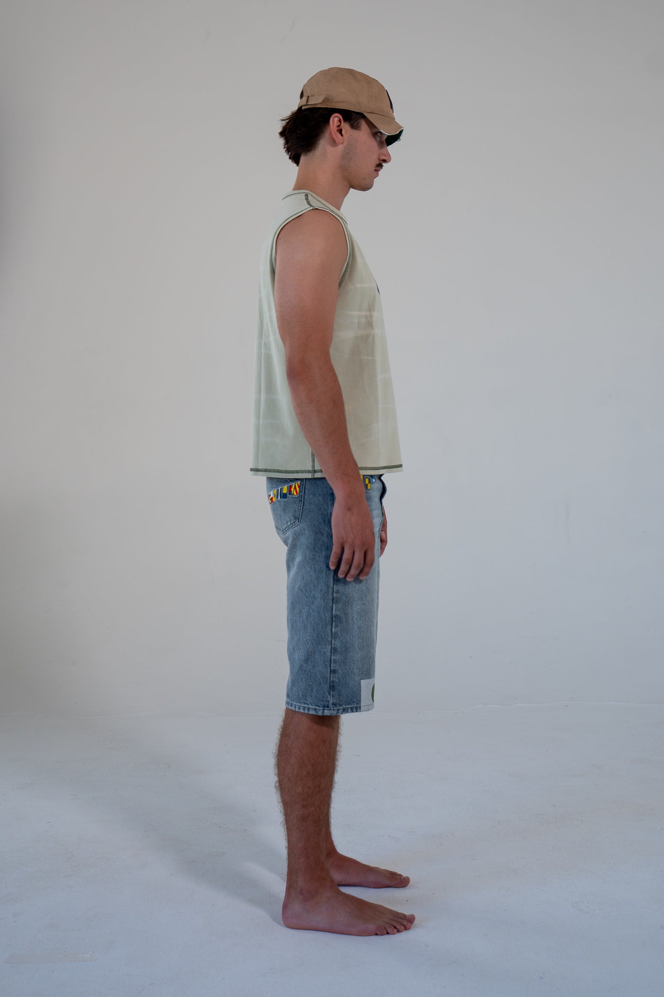 leaf finished cutoff tank top with alloy emblem