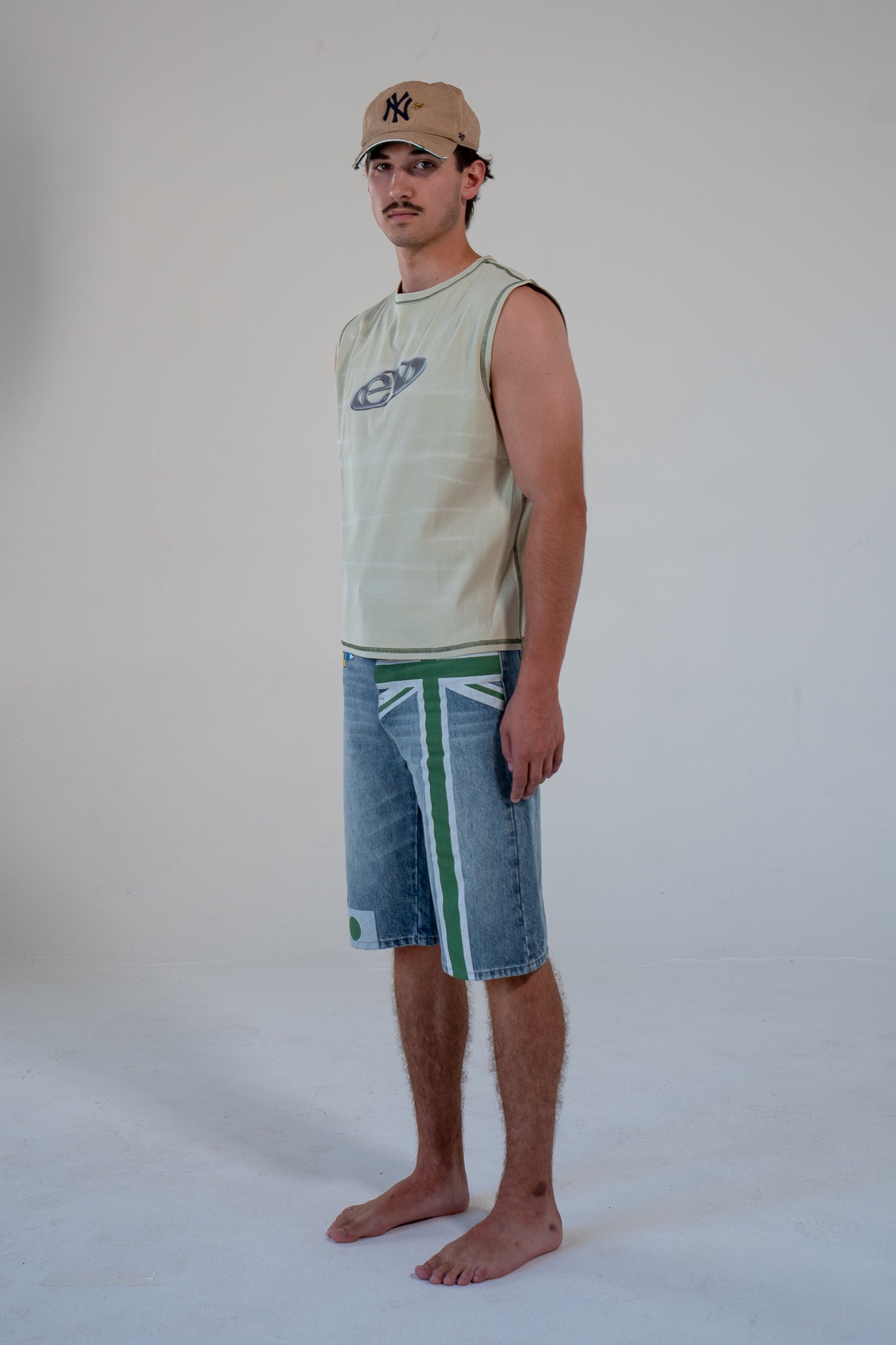 leaf finished cutoff tank top with alloy emblem