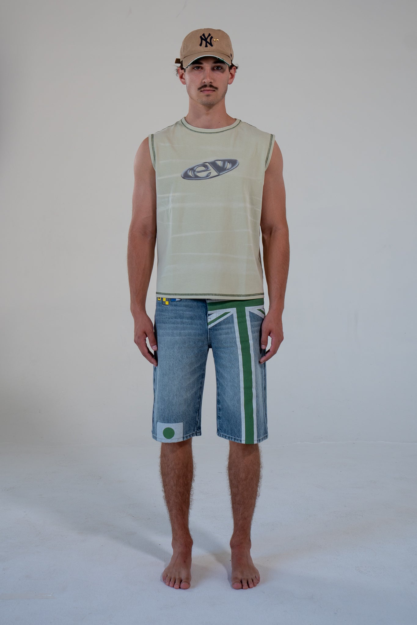 leaf finished cutoff tank top with alloy emblem