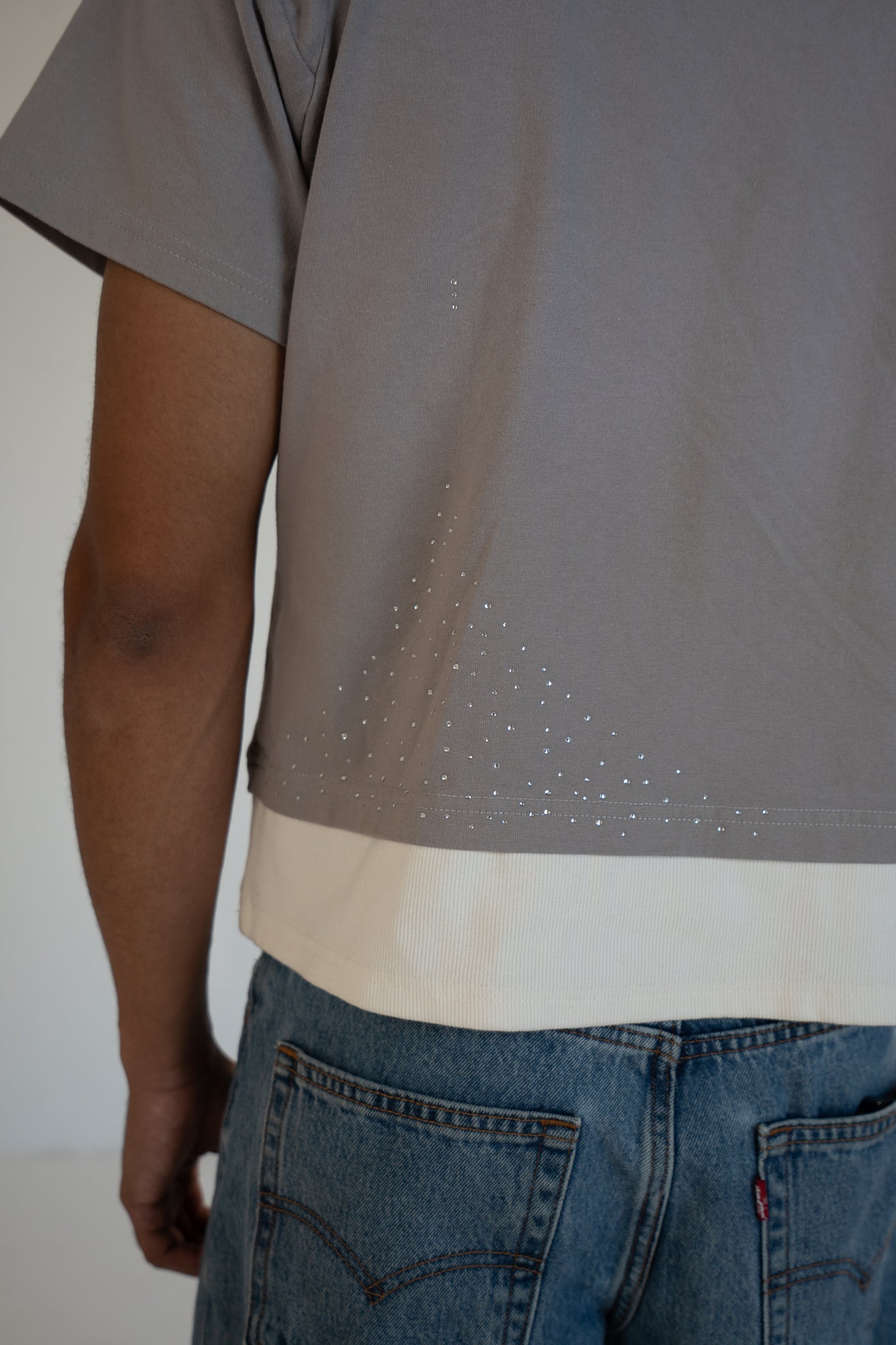 ash strata cotton tee with rhinestones and rose pedal emblem